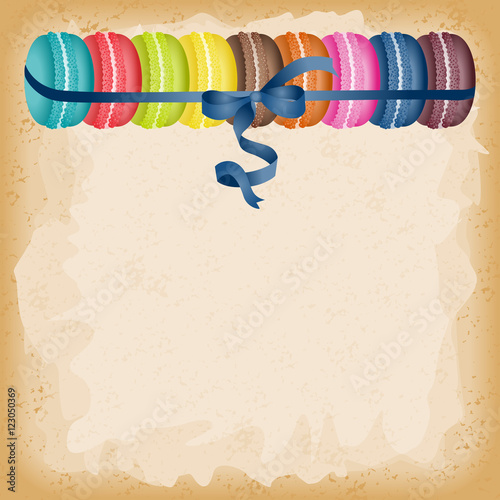 Macarons tied with blue ribbon background
