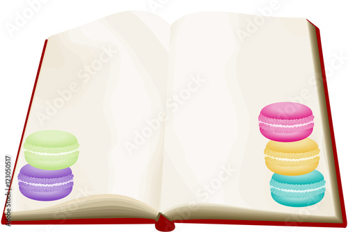 Opened blank book with macarons
