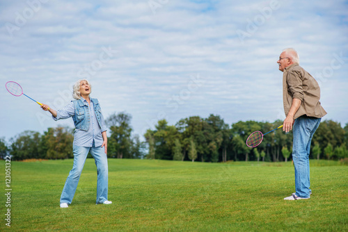 Mature husband and wife entertaining in nature