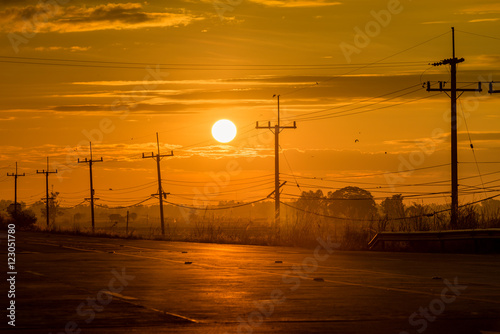 electricity post on sunset background