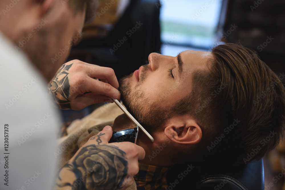 Fototapeta premium customer enjoying at barbershop