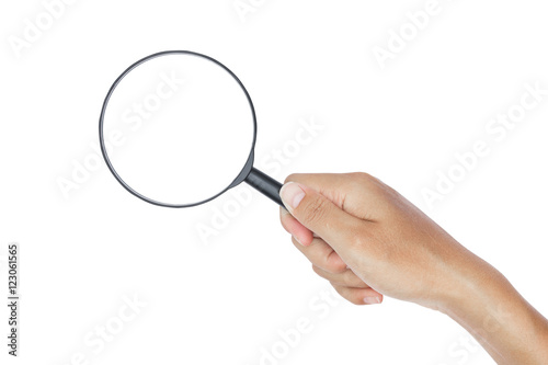 Hand with magnifying glass on white background