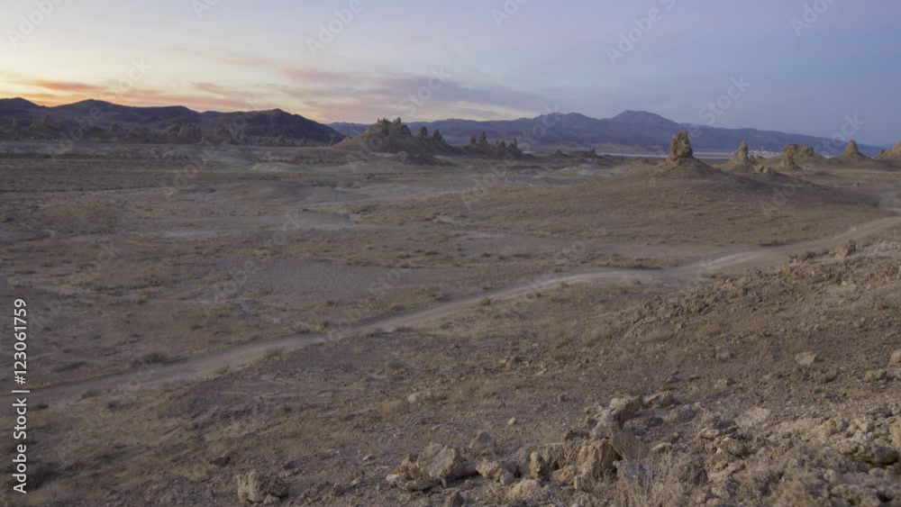 Tracking motion controlled time lapse with dolly left motion of afterglow over desert terrain at Trona Pinnacles, California Tracking motion controlled time lapse with dolly left motion of afterglow over desert terrain at Trona Pinnacles, California