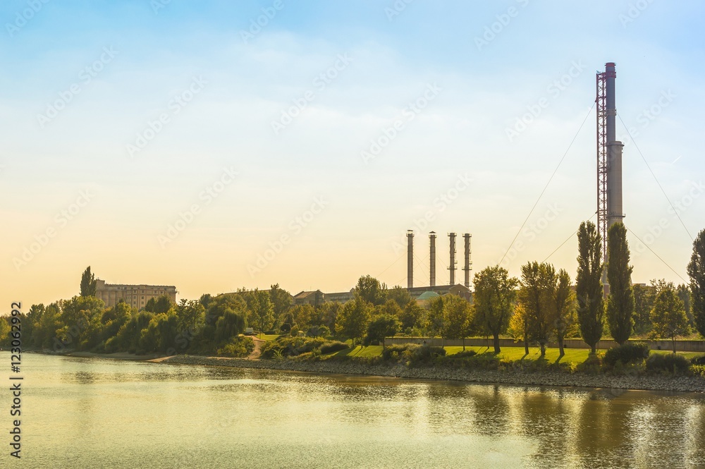 Thermal power plant with trees and blue sky Thermal power plant with trees and blue sky