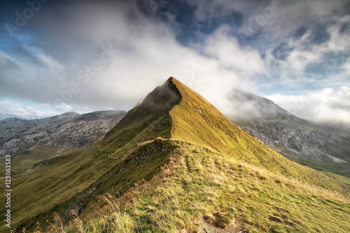 mountain peak in low clouds