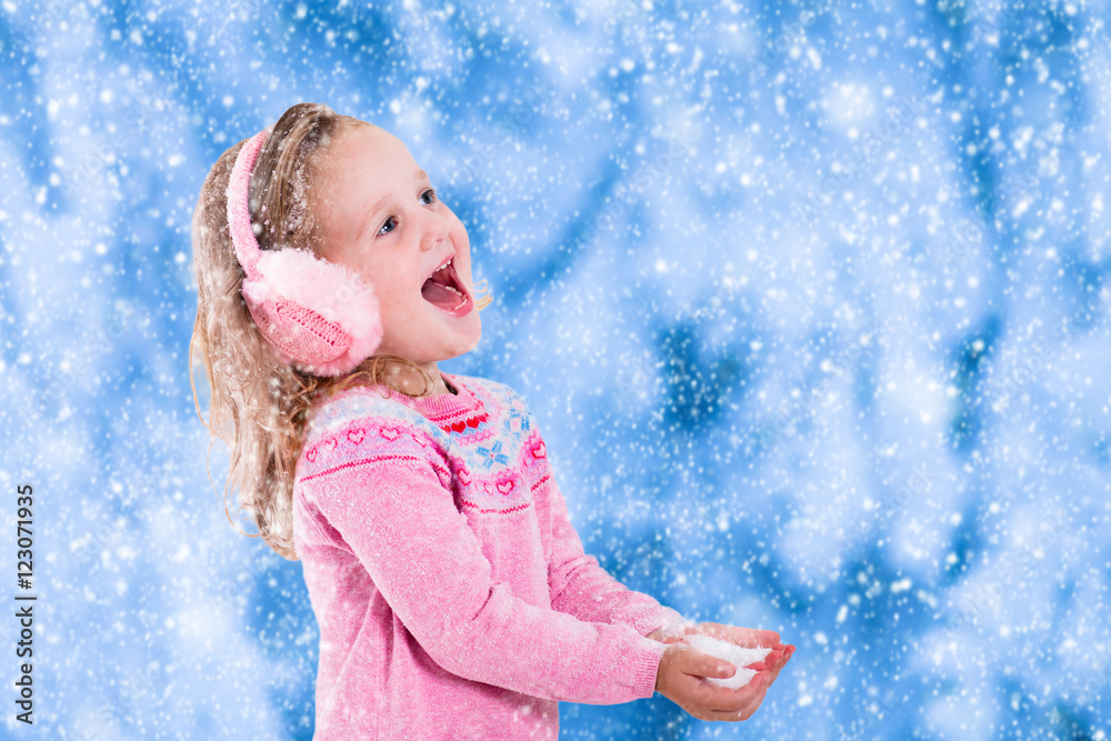 Little girl catching snow flakes Little girl catching snow flakes