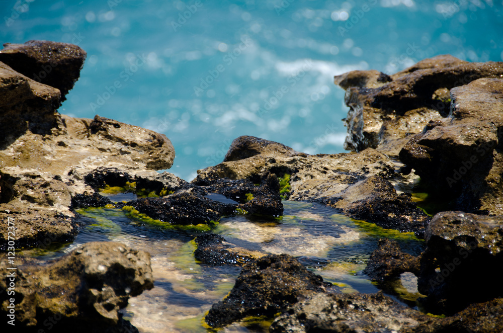 Close-up of rock formations and aquamarine waters near Devils b Close-up of rock formations and aquamarine waters near Devils b