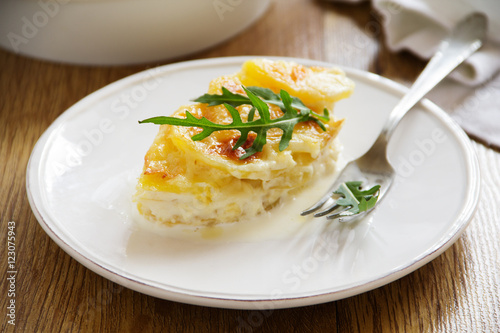 Baked potato Dauphinois on a plate.