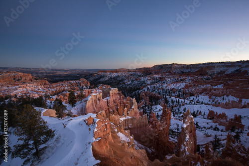 Sunset over canyon slopes covered in snow, Bryce Canyon National