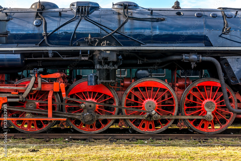 Side view on CSD, Czechoslovak steam locomotive, with huge, red spoke main wheels
