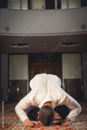 Young Muslim  praying in a mosque. © ildintorlak