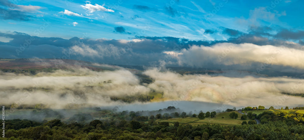 Morning Mist and Dramatic Sky over British Countryside