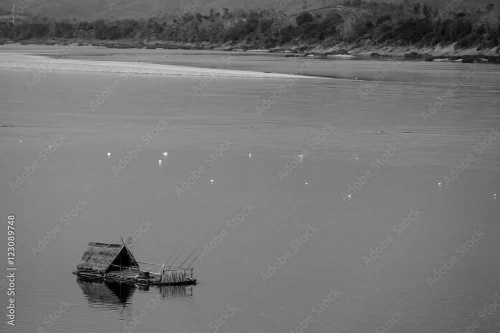 Black and white shot of fishing raft in the river. Black and white shot of fishing raft in the river.