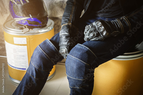 Biker man wearing jeans and leather jecket