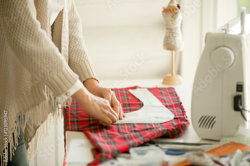 Woman working with a sewing design pattern. Concept photo photo