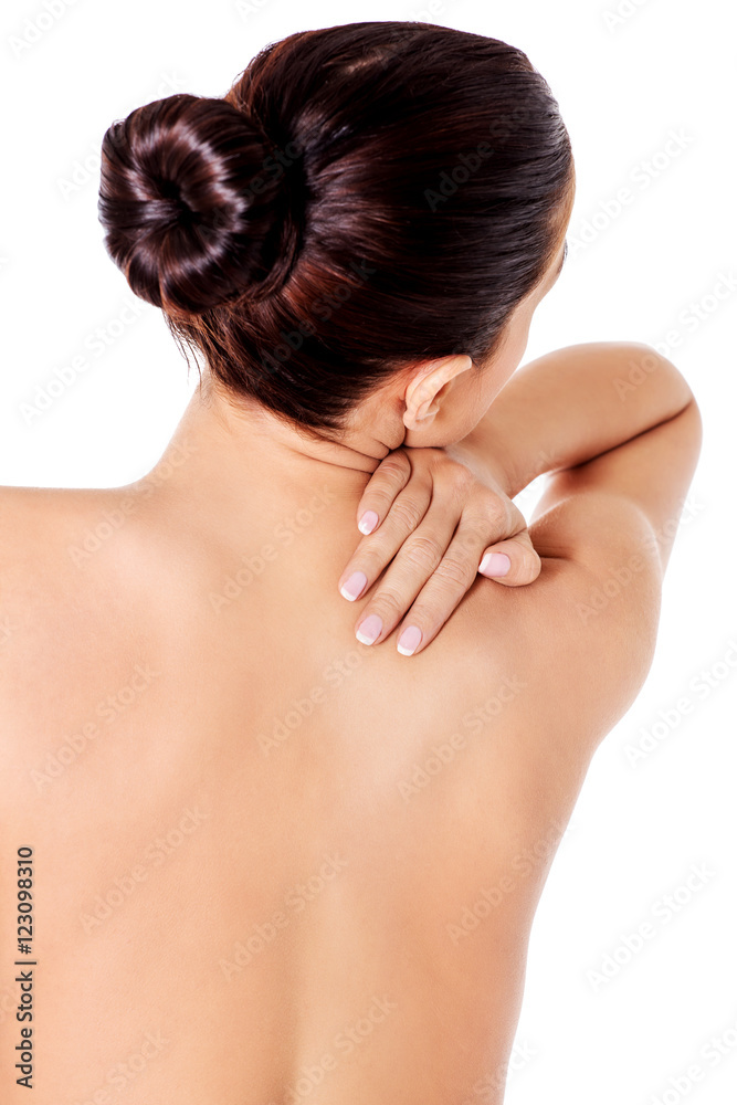 Picture of a woman touching her shoulder Picture of a woman touching her shoulder