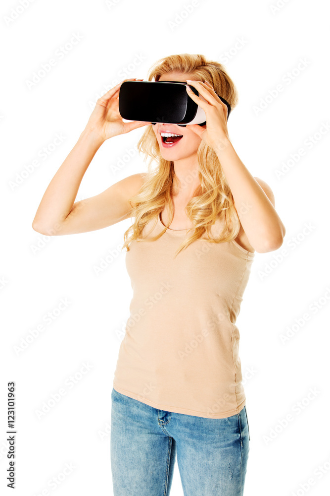 Happy woman wearing virtual reality goggles Happy woman wearing virtual reality goggles