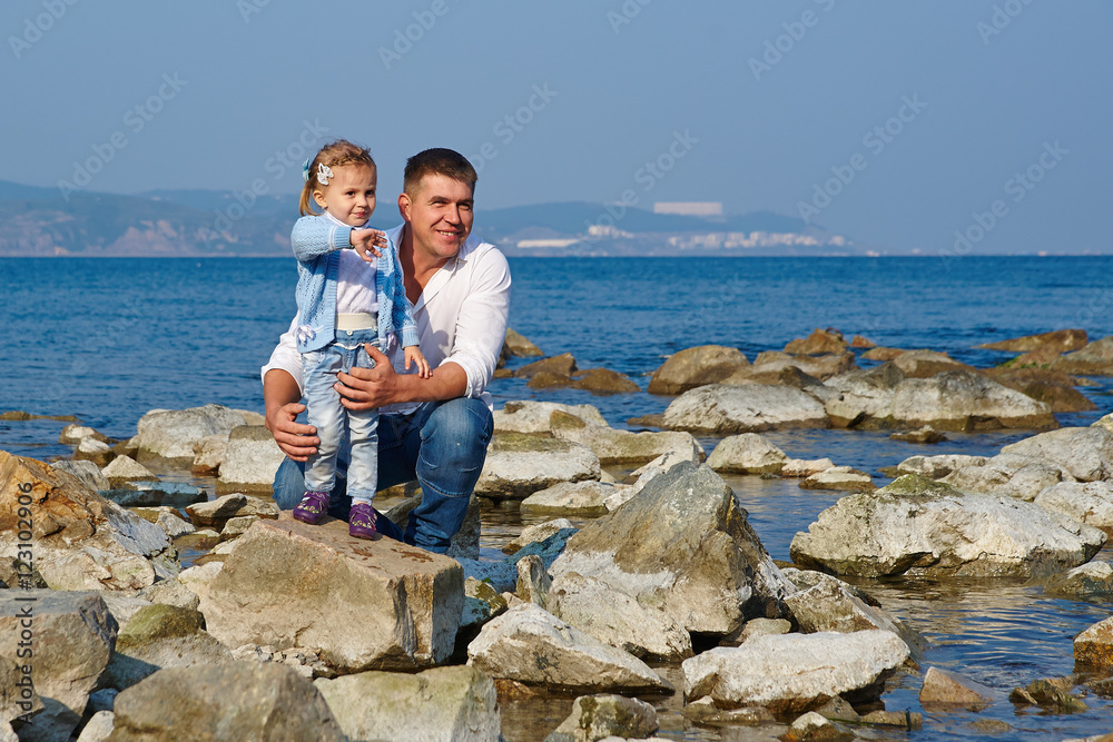 A father and daughter on a beach summer day A father and daughter on a beach summer day