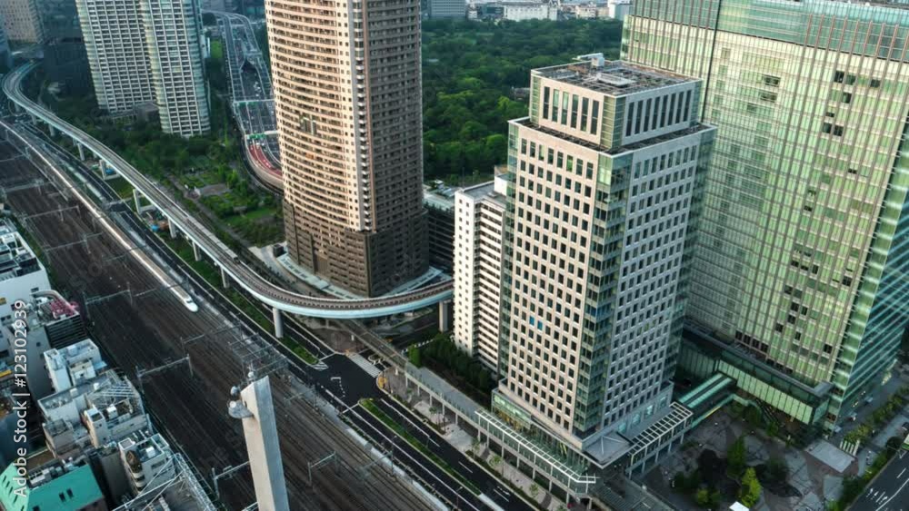 Tokyo - Aerial evening city view with trains and highway traffic. 4K resolution time lapse zoom out. May 2016