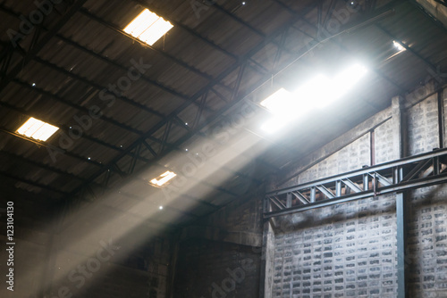 Light beams inside abandoned godown