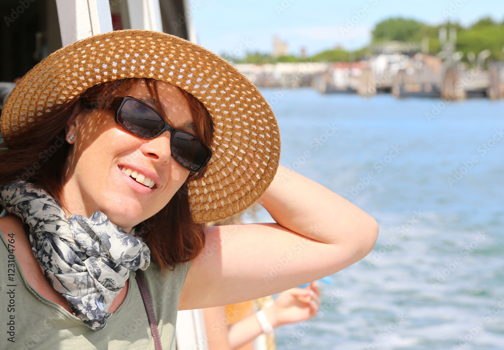 beautiful woman with straw hat and sun glasses