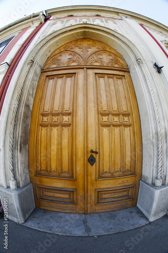 Wooden door with fisheye lens view