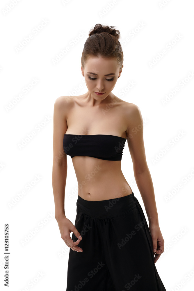 Slender young woman practicing yoga in studio Slender young woman practicing yoga in studio