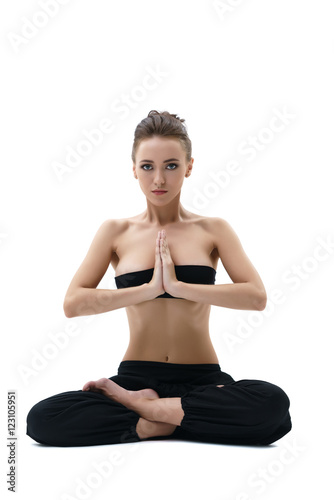 Yoga. Beautiful girl sitting in lotus position