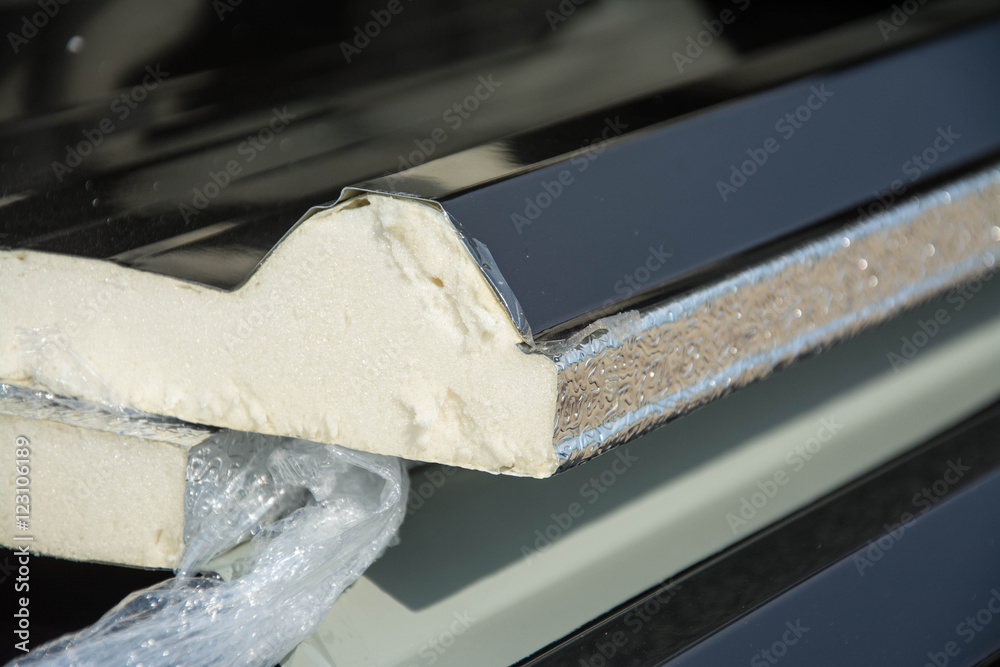 black metal sheet  roof with insulation attached under metal sheet.
