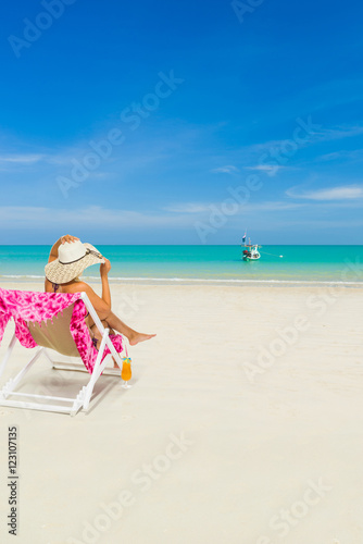 Woman on a deck chair at the beach