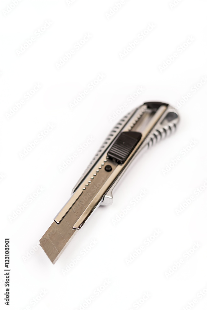 Metal construction scalpel on the white background Metal construction scalpel on the white background
