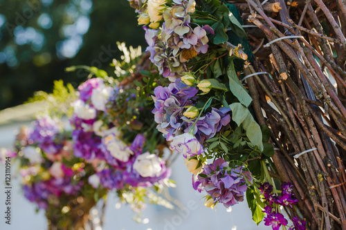 Yellow rose buds put in a wedding altar made of oiser photo