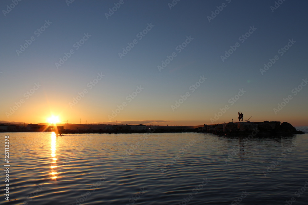 fishermen on the rocks