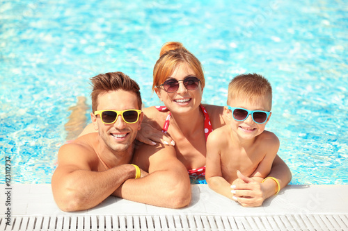 Happy family in swimming pool at water park © Africa Studio