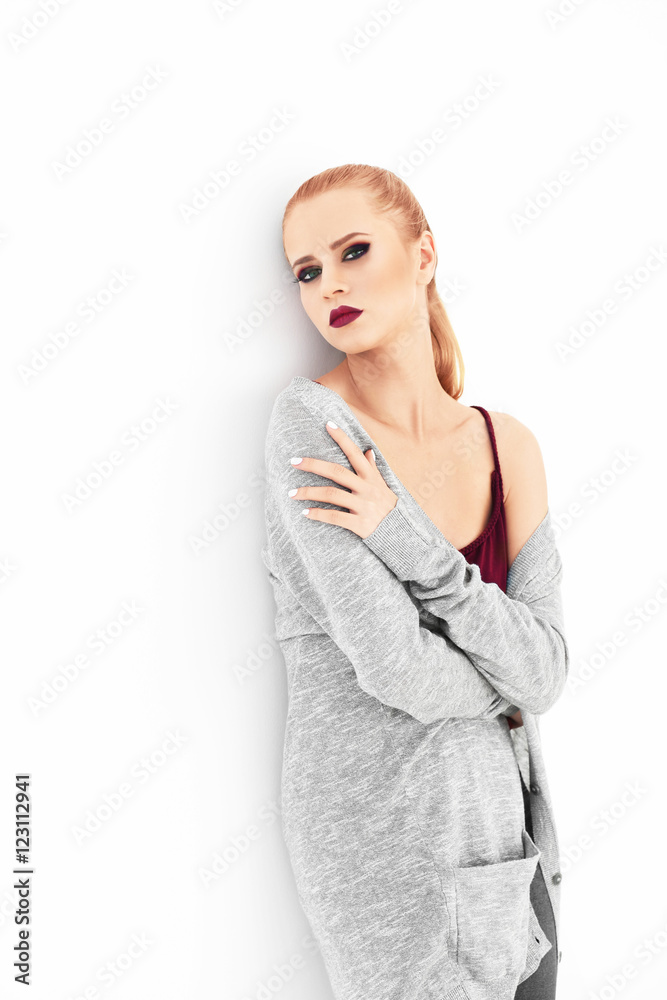 Pretty young blonde woman in casual clothes isolated on white Pretty young blonde woman in casual clothes isolated on white