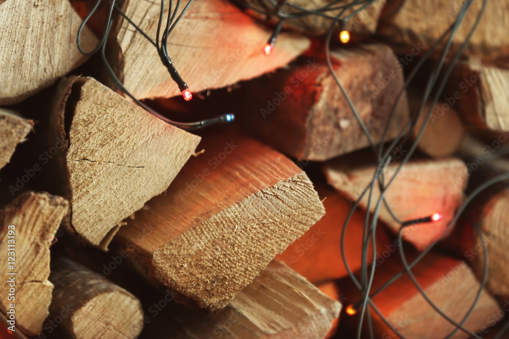 Stack of firewood and garland, close up view