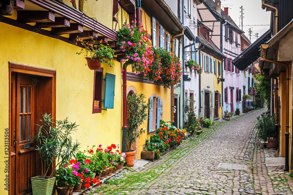 Half-timbered houses on a narrow street in Eguisheim, Alsace, France