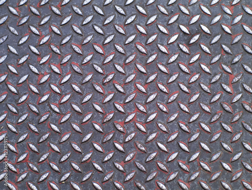 dirty metallic surface with diamond plate pattern
