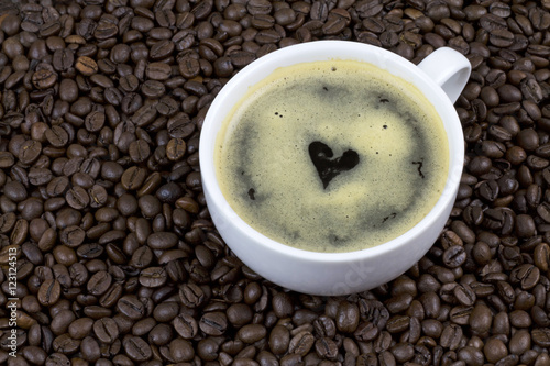 Coffee with heart shape on coffee beans