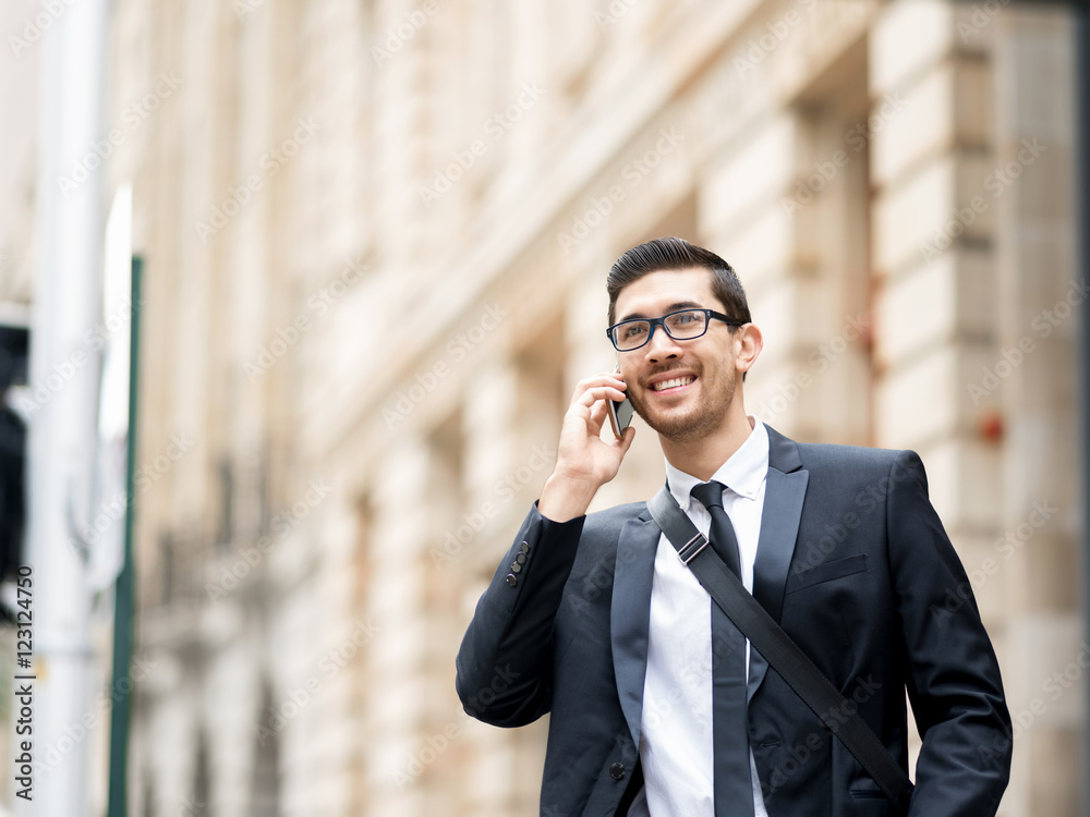 Happy beautiful young businesswoman using smart phone smiling