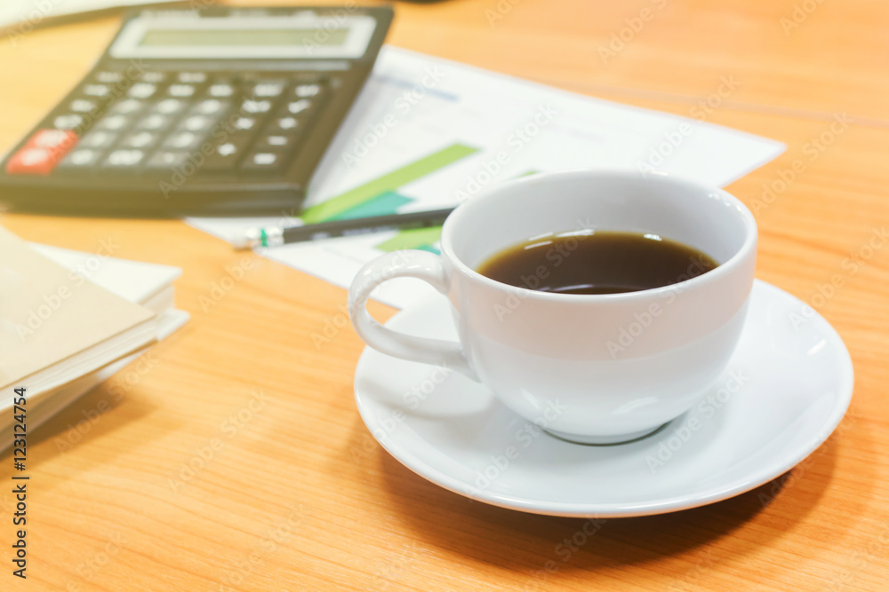 Digital tablet and cup of coffee on old wooden desk Digital tablet and cup of coffee on old wooden desk