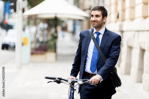 Young businessmen with a bike