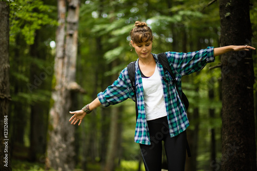 woman in balance in a forest photo