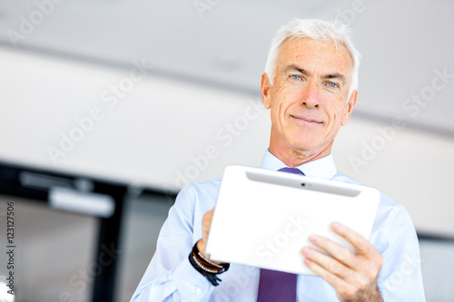 Businessman at the office using tablet