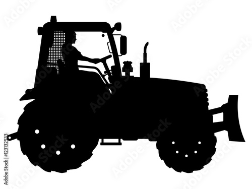 Vector illustration of a tractor. The black silhouette of a tractor with a driver.
