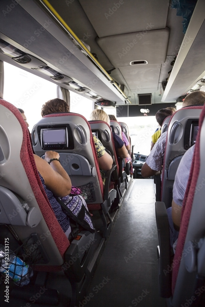 Tourist bus Interior. People go on the tour. Tourist bus Interior. People go on the tour.