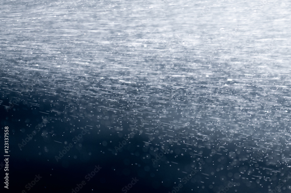 Obraz premium Abstract Background Water Spray In Light