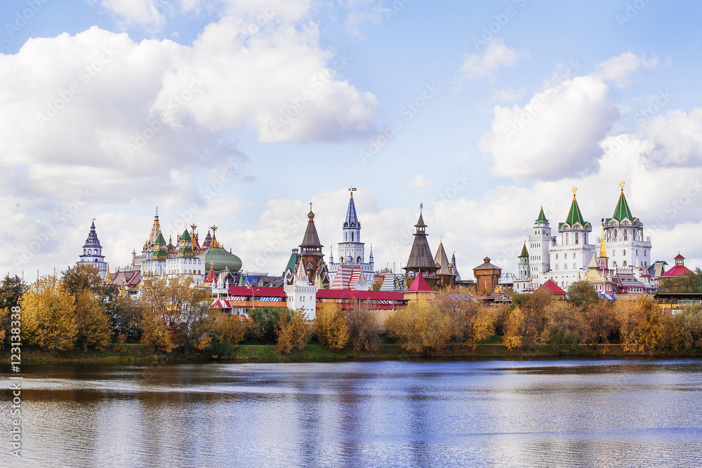 Fairytale russian castle near a lake in autumn.