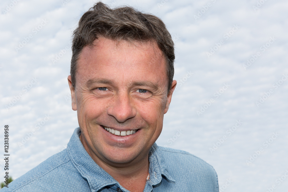 Portrait of a mature handsome man smiling Portrait of a mature handsome man smiling