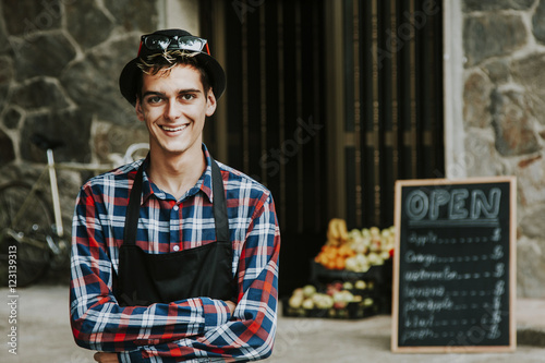 Valokuva enterprising man smiling in front of business
